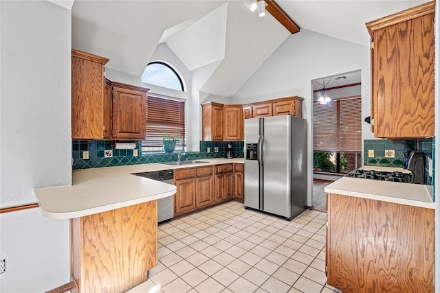 4924 Byron Cir, Yukon, OK 73099 - kitchen with appliances with stainless steel finishes, backsplash, a peninsula, light countertops, and beam ceiling