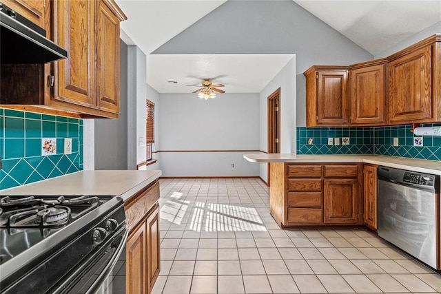 4924 Byron Cir, Yukon, OK 73099 - kitchen with stainless steel dishwasher, under cabinet range hood, light tile patterned flooring, light countertops, and lofted ceiling
