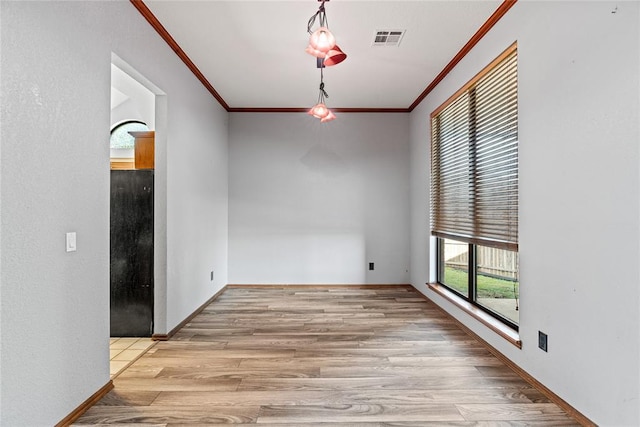 4924 Byron Cir, Yukon, OK 73099 - spare room with ornamental molding and wood finished floors