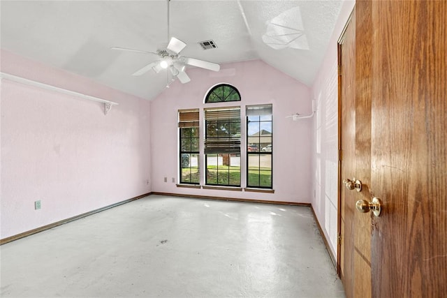 4924 Byron Cir, Yukon, OK 73099 - spare room featuring finished concrete floors, vaulted ceiling, and ceiling fan