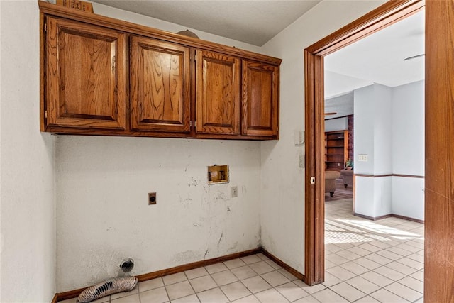 4924 Byron Cir, Yukon, OK 73099 - laundry room with hookup for an electric dryer, hookup for a washing machine, cabinet space, and light tile patterned floors