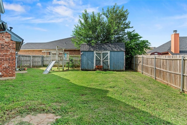 4924 Byron Cir, Yukon, OK 73099 - fenced backyard with a storage shed and a playground