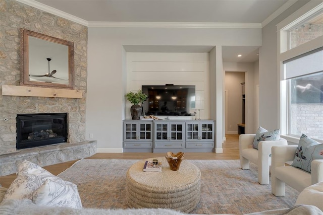 3624 Utica Square Dr, Edmond, OK 73034 - living room featuring a fireplace, crown molding, wood finished floors, and a ceiling fan