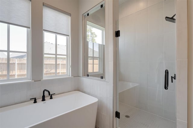 3624 Utica Square Dr, Edmond, OK 73034 - bathroom featuring a freestanding tub, a shower stall, and plenty of natural light