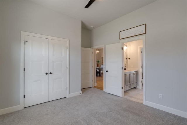 3624 Utica Square Dr, Edmond, OK 73034 - unfurnished bedroom featuring light colored carpet, a closet, and ensuite bathroom