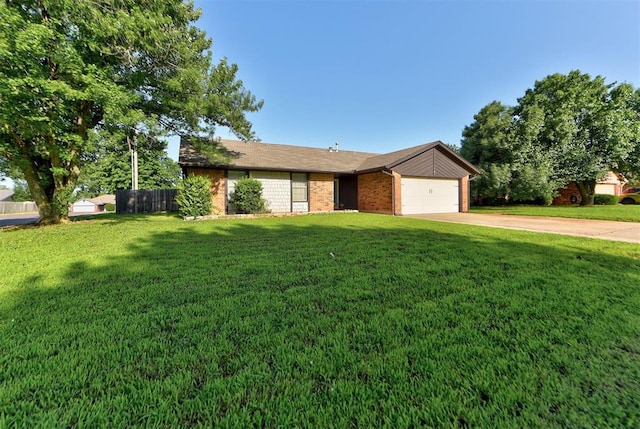 1229 S Gemini Rd, Edmond, OK 73003 - ranch-style home with concrete driveway, a garage, and brick siding
