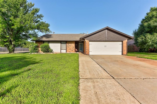 1229 S Gemini Rd, Edmond, OK 73003 - view of front of house with brick siding, an attached garage, and driveway