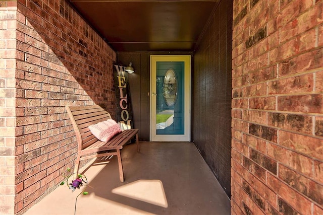1229 S Gemini Rd, Edmond, OK 73003 - entrance to property featuring brick siding and a porch