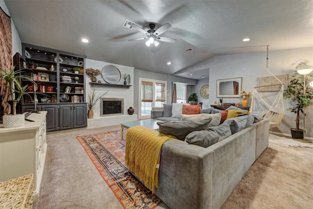 1229 S Gemini Rd, Edmond, OK 73003 - living room with light colored carpet, ceiling fan, vaulted ceiling, a brick fireplace, and recessed lighting