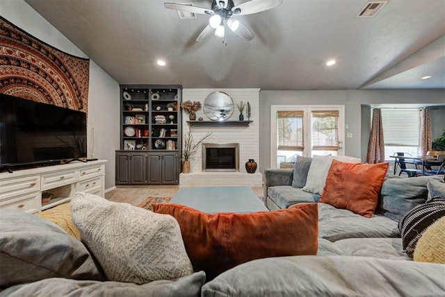 1229 S Gemini Rd, Edmond, OK 73003 - living area with ceiling fan, a brick fireplace, and recessed lighting