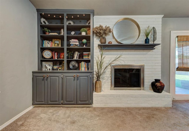 1229 S Gemini Rd, Edmond, OK 73003 - living area featuring carpet flooring and a brick fireplace