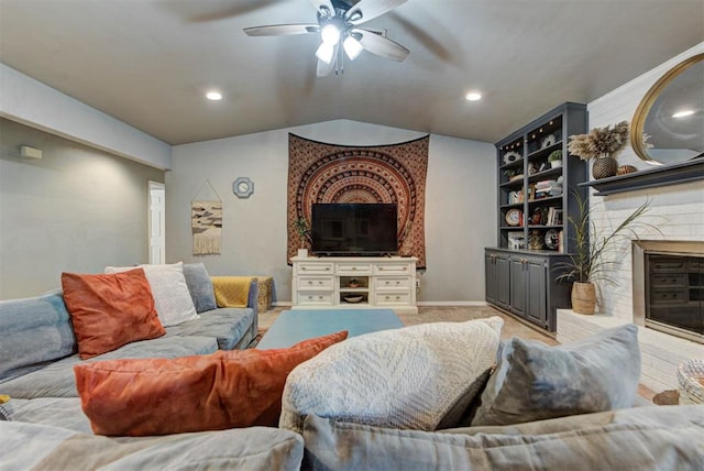 1229 S Gemini Rd, Edmond, OK 73003 - living room with a ceiling fan, a fireplace, lofted ceiling, light colored carpet, and recessed lighting