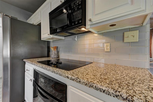 1229 S Gemini Rd, Edmond, OK 73003 - kitchen featuring black appliances, backsplash, white cabinets, and light stone counters