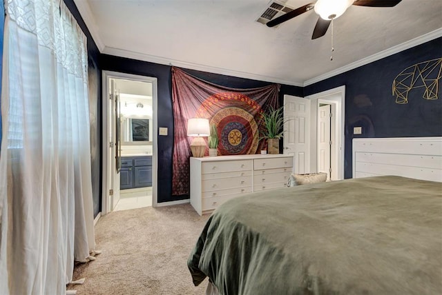 1229 S Gemini Rd, Edmond, OK 73003 - carpeted bedroom with crown molding, connected bathroom, and ceiling fan