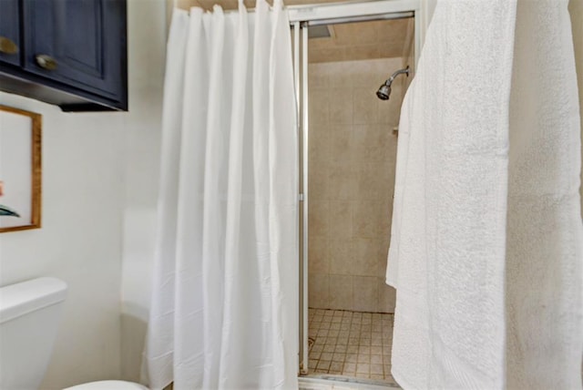 1229 S Gemini Rd, Edmond, OK 73003 - bathroom featuring a shower stall and toilet