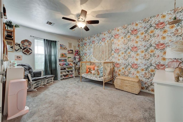 1229 S Gemini Rd, Edmond, OK 73003 - sitting room with carpet, a ceiling fan, and wallpapered walls
