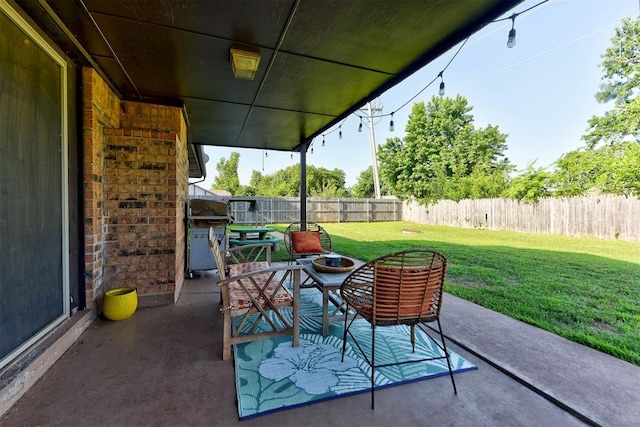 1229 S Gemini Rd, Edmond, OK 73003 - fenced backyard with a patio and a grill