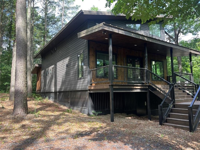 179 Long Pine Trl, Broken Bow, OK 74728 - view of front of house featuring stairs and covered porch