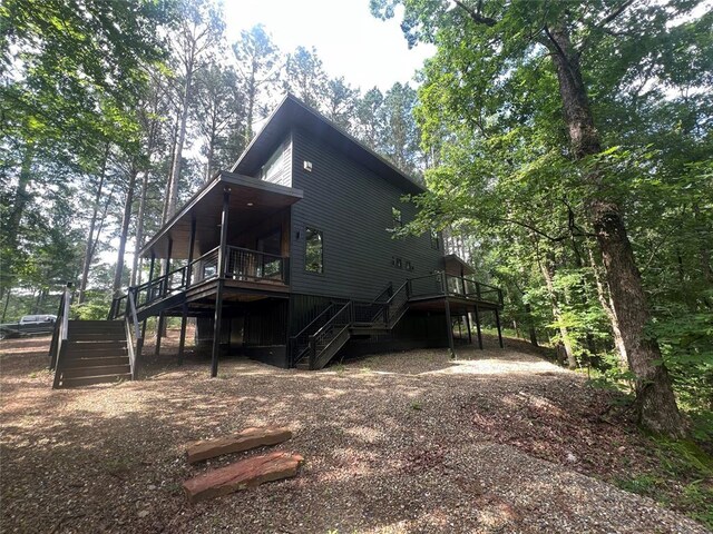 179 Long Pine Trl, Broken Bow, OK 74728 - rear view of property with stairs and a wooden deck