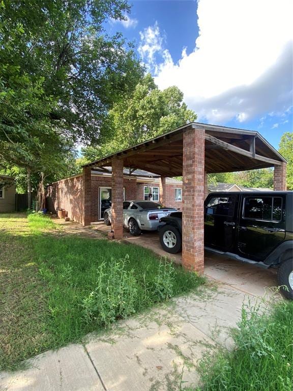 2451 NW 42nd St, Oklahoma City, OK 73112 - view of parking featuring concrete driveway