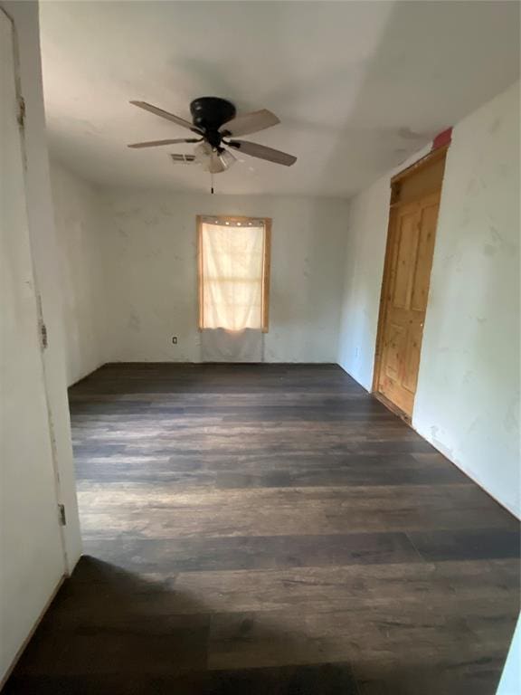 2451 NW 42nd St, Oklahoma City, OK 73112 - unfurnished room featuring ceiling fan and dark wood-style floors
