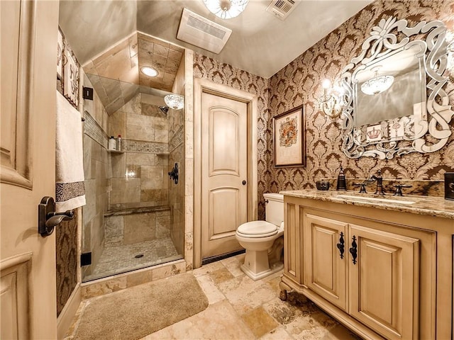 12912 Anduin Ave, Oklahoma City, OK 73170 - bathroom featuring a shower stall, vanity, stone finish floors, and wallpapered walls