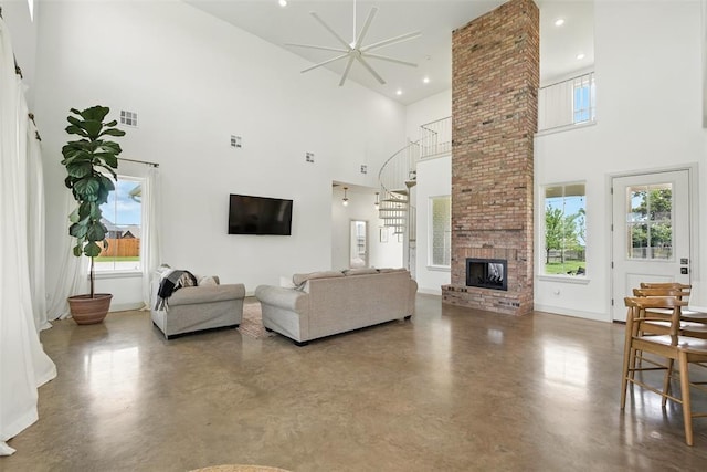 1006 Dorsi Way, Newcastle, OK 73065 - living area with a high ceiling, finished concrete floors, a fireplace, a ceiling fan, and recessed lighting