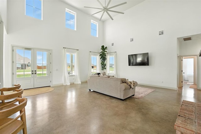 1006 Dorsi Way, Newcastle, OK 73065 - living area featuring a high ceiling, finished concrete flooring, french doors, and ceiling fan