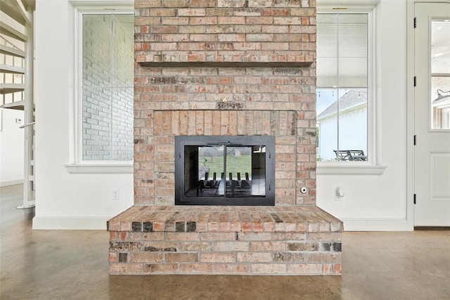 1006 Dorsi Way, Newcastle, OK 73065 - detailed view of concrete floors and a brick fireplace