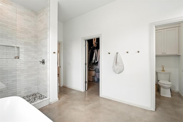 1006 Dorsi Way, Newcastle, OK 73065 - bathroom featuring finished concrete flooring, a freestanding bath, a shower stall, and a walk in closet