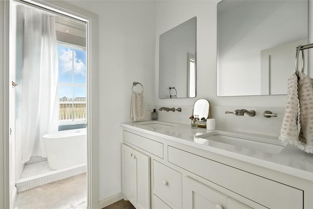 1006 Dorsi Way, Newcastle, OK 73065 - bathroom with double vanity and a freestanding bath