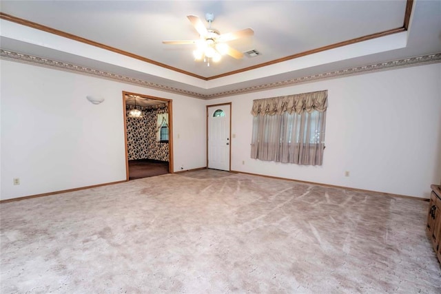 511 N Turner Rd, Chandler, OK 74834 - carpeted spare room featuring a tray ceiling, ceiling fan, and ornamental molding