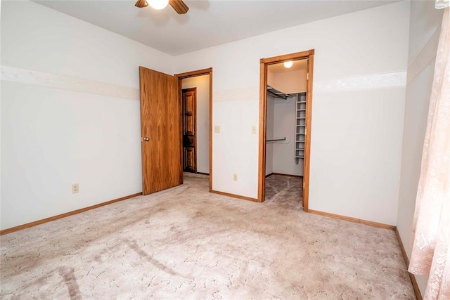511 N Turner Rd, Chandler, OK 74834 - unfurnished bedroom featuring a spacious closet, carpet flooring, a closet, and ceiling fan