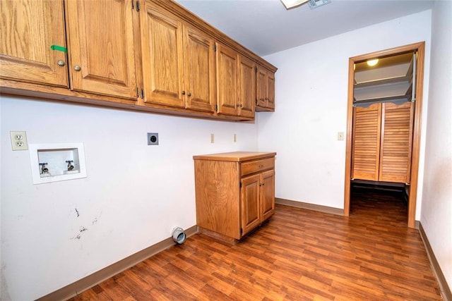 511 N Turner Rd, Chandler, OK 74834 - washroom with washer hookup, hookup for an electric dryer, cabinet space, and dark wood-type flooring