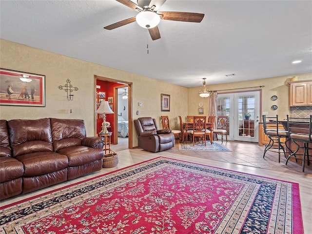 1008 County Road 1580, Marlow, OK 73055 - living room with ceiling fan, french doors, and light wood-style flooring