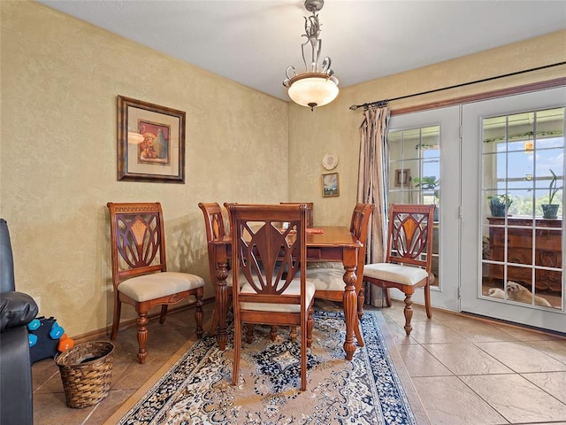 1008 County Road 1580, Marlow, OK 73055 - dining room featuring a textured wall and tile patterned floors
