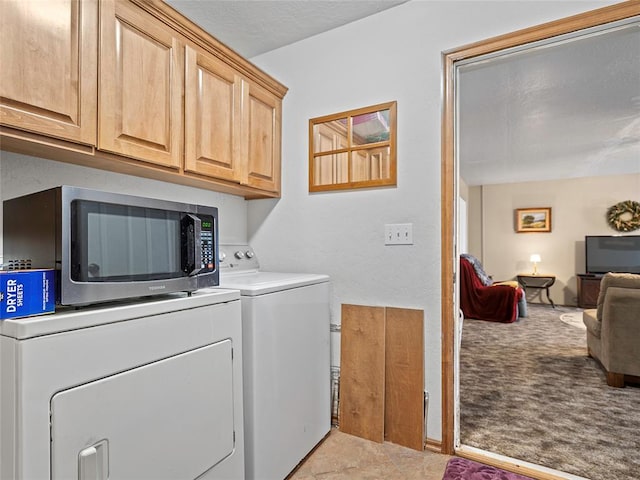 1008 County Road 1580, Marlow, OK 73055 - washroom featuring washer and clothes dryer, cabinet space, and light colored carpet