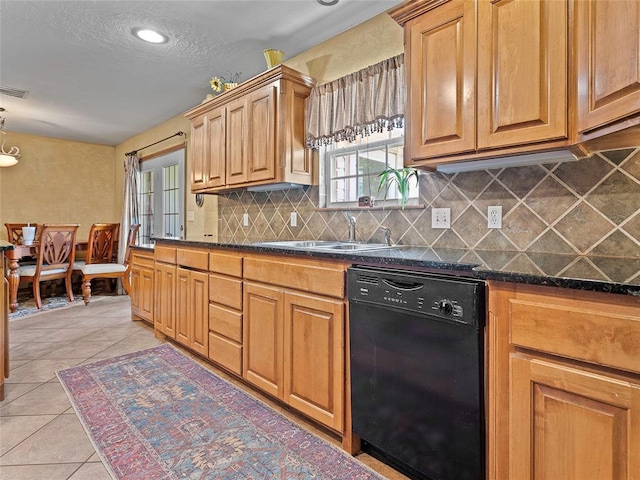 1008 County Road 1580, Marlow, OK 73055 - kitchen featuring black dishwasher, backsplash, light tile patterned floors, healthy amount of natural light, and a textured ceiling