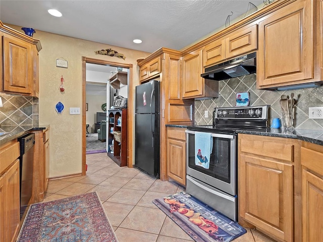 1008 County Road 1580, Marlow, OK 73055 - kitchen featuring stainless steel range with electric stovetop, freestanding refrigerator, under cabinet range hood, tasteful backsplash, and light tile patterned floors