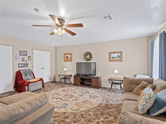 1008 County Road 1580, Marlow, OK 73055 - living area with a ceiling fan, a textured ceiling, and carpet flooring