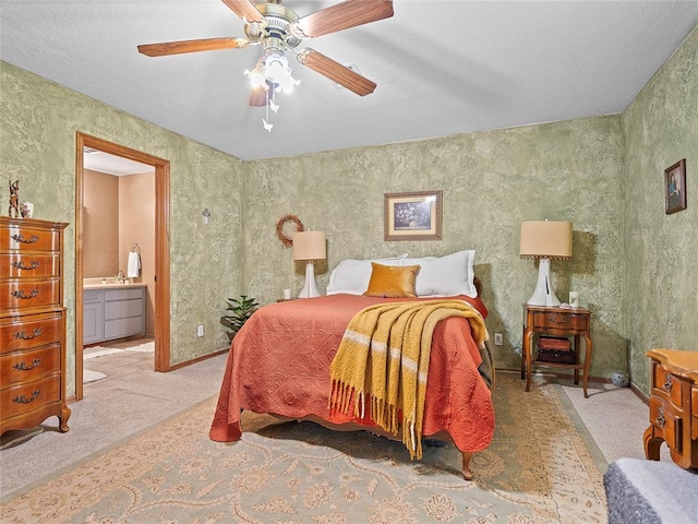 1008 County Road 1580, Marlow, OK 73055 - carpeted bedroom featuring a ceiling fan and connected bathroom