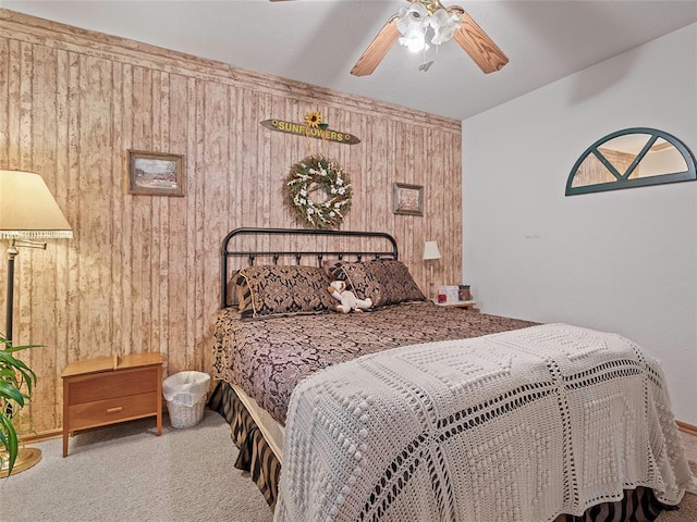 1008 County Road 1580, Marlow, OK 73055 - carpeted bedroom featuring wood walls and a ceiling fan