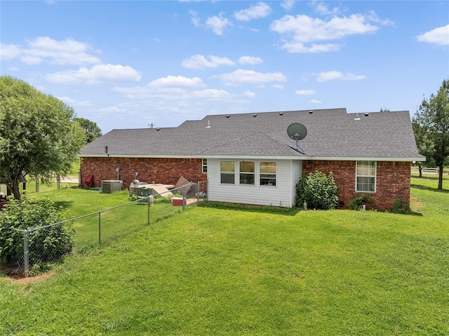 1008 County Road 1580, Marlow, OK 73055 - rear view of property featuring roof with shingles and brick siding