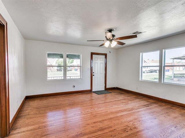 2212 N Kelham Ave, Oklahoma City, OK 73111 - spare room featuring light wood finished floors and ceiling fan