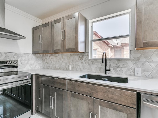 2212 N Kelham Ave, Oklahoma City, OK 73111 - kitchen with wall chimney range hood, appliances with stainless steel finishes, ornamental molding, tasteful backsplash, and dark brown cabinetry