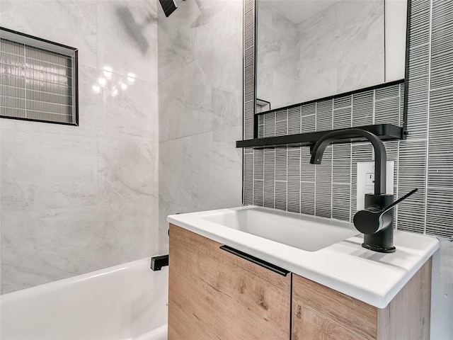 2212 N Kelham Ave, Oklahoma City, OK 73111 - bathroom featuring tile walls, vanity, and tub / shower combination