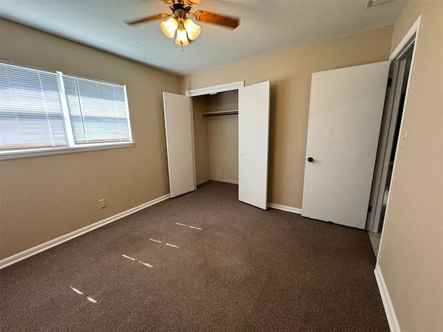unfurnished bedroom featuring carpet floors, ceiling fan, and a closet