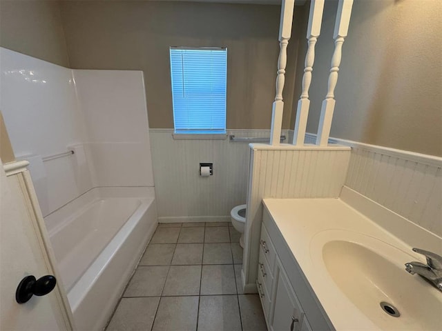 bathroom with wainscoting, vanity, and tile patterned floors