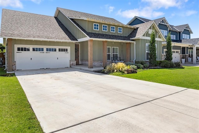1724 Campus Corner Pl, Edmond, OK 73034 - craftsman-style house featuring board and batten siding, a garage, driveway, and a front yard