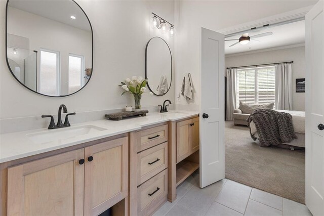 1724 Campus Corner Pl, Edmond, OK 73034 - ensuite bathroom featuring double vanity, tile patterned floors, a ceiling fan, and ornamental molding